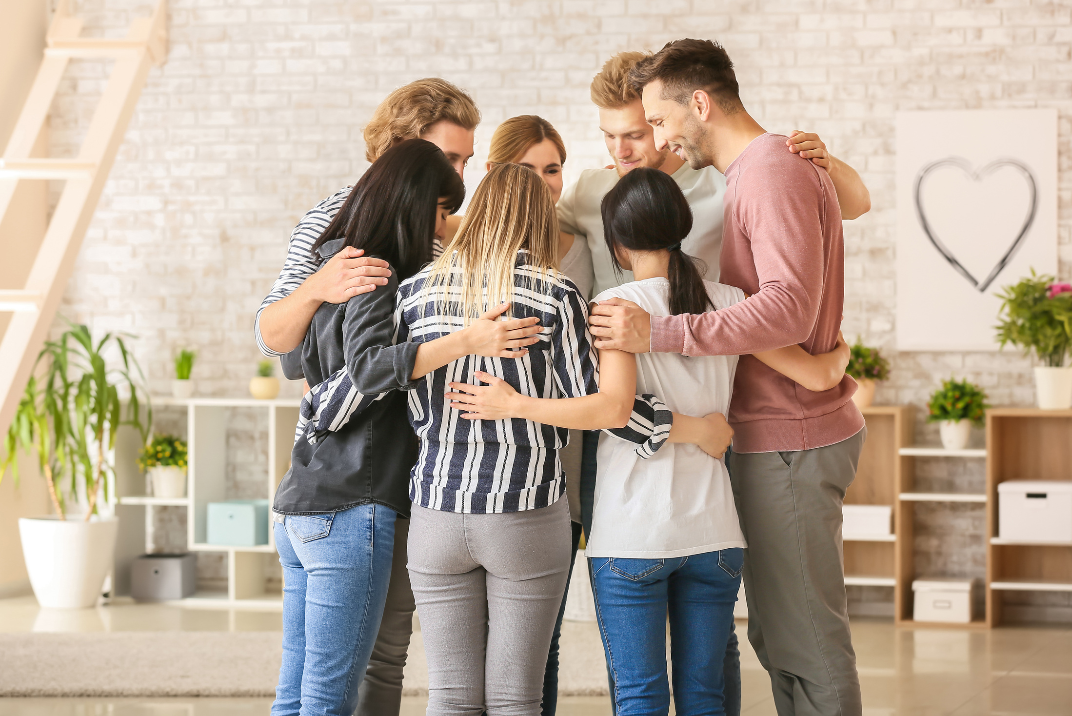 People Hugging at Group Therapy Session